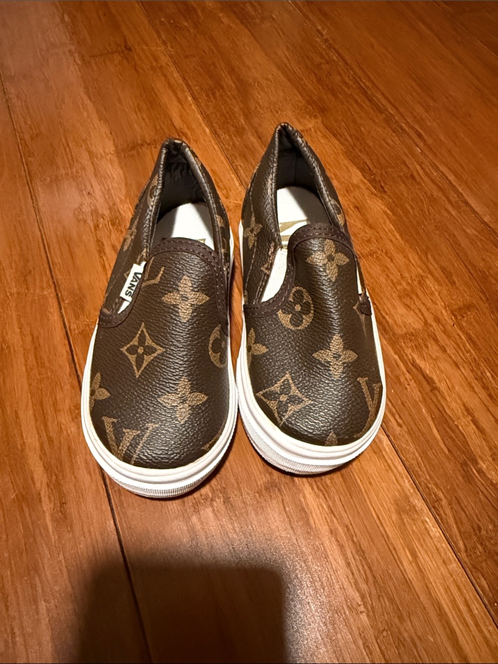 Vans Kids Slip-On Sneakers in Brown Monogram Print